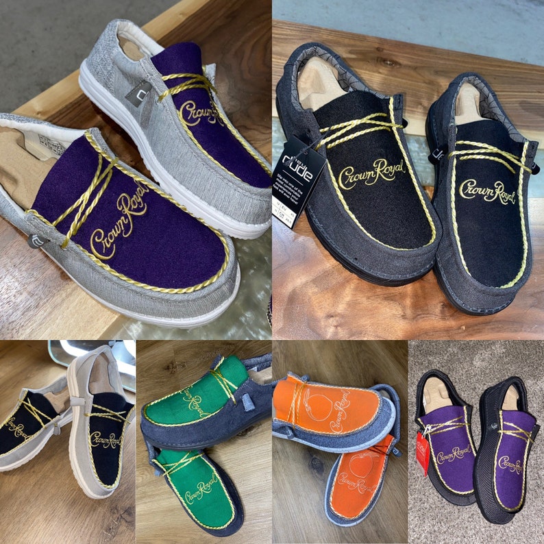 May include: A collection of ten pairs of slip-on shoes with a Crown Royal logo embroidered on the top. The shoes are in various colors, including gray, black, green, orange, and purple.