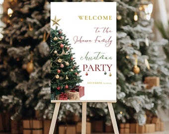 May include: A white sign on a wooden easel with the words "WELCOME to the Johnson Family Christmas PARTY" in gold and red. A decorated Christmas tree and wrapped gifts are on the left. The date "DECEMBER 12, 2025" is at the bottom.