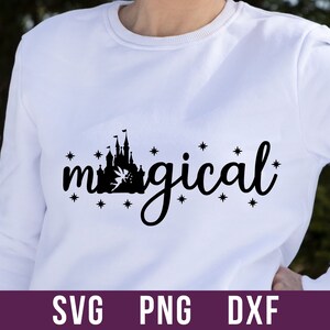 May include: White sweatshirt with a black silhouette of a castle and the word "magical" with stars around it.