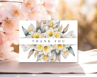 May include: White thank you card with a watercolor illustration of a bouquet of yellow and white daffodils. The text "THANK YOU" is printed in black on a white banner.