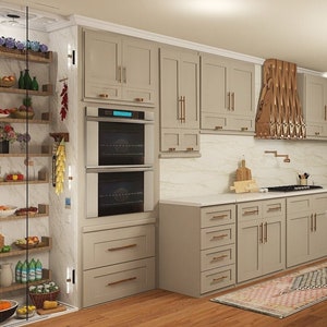 May include: A modern kitchen with light gray cabinets, a white countertop, and a central island with a microwave. The kitchen features a double oven, a decorative range hood, and a window with natural light. The floor is made of wood.