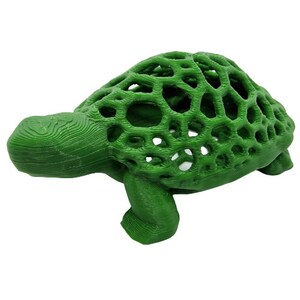 May include: A green 3D printed turtle figurine with a hollow, lattice-like shell. The turtle is posed with its head turned to the left and its legs tucked underneath its body.