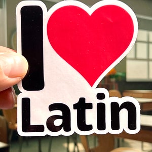 May include: A white sticker with a black "I" and a red heart, followed by the word "Latin" in black letters.