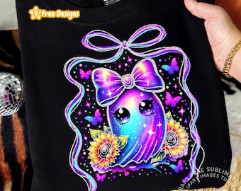 May include: A black sweatshirt featuring a colourful graphic of a ghost with large eyes, wearing a purple and blue gradient bow. The design includes two sunflowers, several small butterflies, and a large ribbon border with sparkling accents.