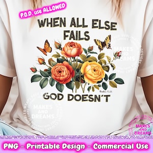 May include: White t-shirt with a floral design and the text "When all else fails God doesn't". The text is in black and the flowers are in shades of orange, yellow, and green. The shirt is a print-on-demand design.