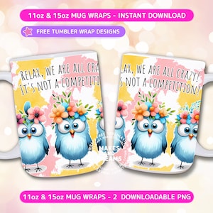May include: Two 11oz and 15oz white mugs with a design featuring three blue birds with flowers on their heads. The mugs have a pink and yellow watercolor background with the text "Relax, we are all crazy! It's not a competition!"