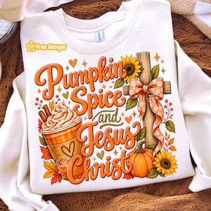 May include: A white crewneck sweatshirt featuring a graphic print with the text Pumpkin Spice and Jesus Christ. The design includes a coffee cup with whipped cream, a wooden cross with a patterned bow, sunflowers, a pumpkin, and autumn leaves.