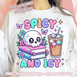May include: White sweatshirt with a colorful graphic design. The design features a skull on top of books, a drink with ice cubes, butterflies, flowers, and the text "SPICY AND ICY". The design is in pastel colors.