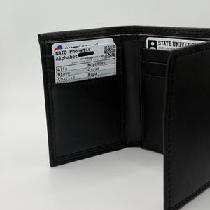 Plastic card titled "NATO Phonetic Alphabet" inside a wallet pocket.