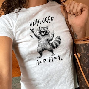 Unhinged And Feral Baby Tee, Funny Graphic Tee, Y2K Aesthetic Baby Tee, Retro Vintage 90s Style Shirt, Crop Top, Funny Raccoon Tee