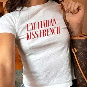Eat Italian Kiss French Baby Tee, Flirty Red Text Shirt, Retro Y2K Crop Top, Travel Food Meme Shirt, Baby Tee For Women, Graphic Tee