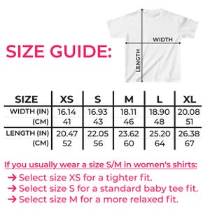 May include: White t-shirt with a size guide chart. The chart shows width and length measurements in inches and centimeters for sizes XS to XL. The text "SIZE GUIDE" is in pink.