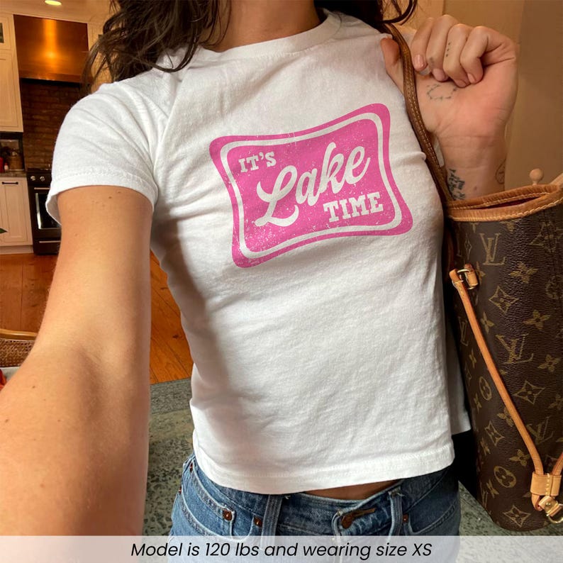 Woman wearing "It's Lake Time" baby tee
