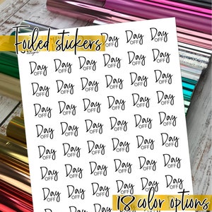 May include: Sheet of white foiled stickers with the text "Day Off" repeated multiple times in a handwritten font. The words "Foiled stickers" and "18 color options" are also visible. The background includes rolls of colorful foil.
