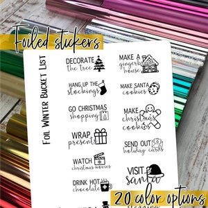 May include: A white sheet of paper with black text and illustrations. The text includes "FOIL WINTER BUCKET LIST" and phrases like "Decorate the tree", "Hang up the stockings", "Make gingerbread house", "Make Santa cookies", "Go Christmas shopping", "Make Christmas cookies", "Wrap presents", "Send out holiday cards", "Watch Christmas movies", "Visit Santa", "Drink hot chocolate", and "20 color options".