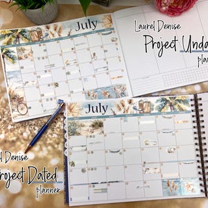 May include: Two open planners with a July calendar page. The top planner is labeled "Laurel Denise Project Undated Planner" and the bottom planner is labeled "Laurel Denise Project Dated Planner". Both planners have a beach theme with palm trees, seashells, and ocean waves.