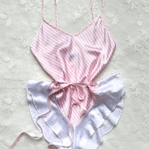 Dorable baby pink striped satin bodysuit featuring polka dots hemline fringe