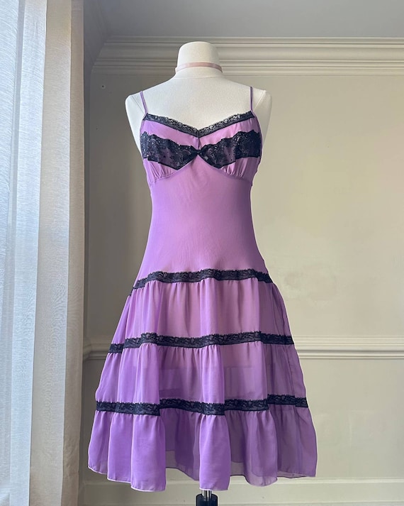 Vibrant purple midi dress featuring black lace lin