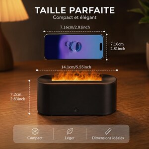 May include: A black, rectangular tabletop fireplace with a simulated flame effect. The dimensions are 7.2cm high, 14.1cm wide, and 7.16cm deep. A smartphone is shown above the fireplace for scale. The text reads "TAILLE PARFAITE Compact et &eacute;l&eacute;gant."