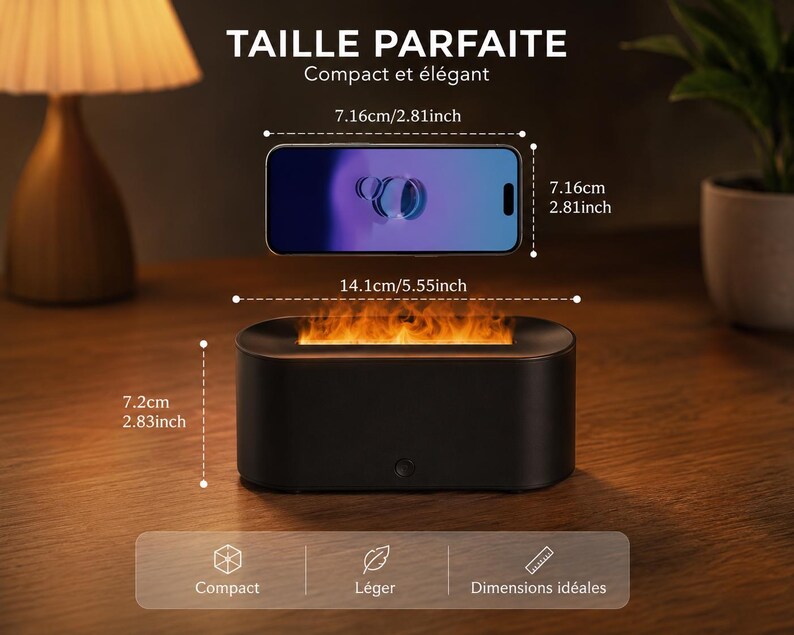 May include: A black, rectangular tabletop fireplace with a simulated flame effect. The dimensions are 7.2cm high, 14.1cm wide, and 7.16cm deep. A smartphone is shown above the fireplace for scale. The text reads "TAILLE PARFAITE Compact et &eacute;l&eacute;gant."