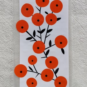 May include: A white background with a black and orange floral design. The design features a cluster of orange circles with black centers, connected by black stems and leaves.
