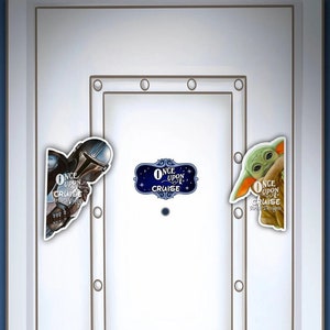 May include: A white door with a silver door handle and a black door knob. There are three stickers on the door, each with a different character from the Star Wars franchise. The stickers say "Once Upon a Cruise".