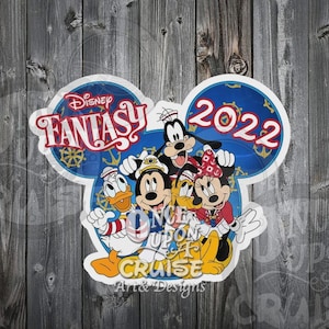May include: A die-cut sticker shaped like Mickey Mouse ears featuring Disney Fantasy 2022 text, a ship's wheel, and illustrations of Donald Duck, Mickey Mouse, Goofy, Pluto, and Minnie Mouse with the text Once Upon A Cruise Art & Designs.