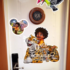 May include: A white door featuring a circular room number sign 6516, a toucan sticker, a Mickey-shaped sticker with a character named Antonio, and a large sticker of a character riding a jaguar with the text Once Upon A Cruise Art & Designs.
