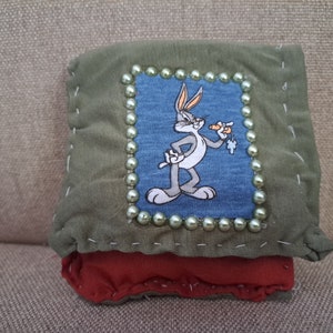 Cartera tipo clutch con personaje