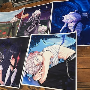 May include: Set of 8 different anime-style illustrations printed on white paper. The illustrations feature characters with white and black hair, wearing various outfits. Some of the illustrations have a dark background, while others have a light background.