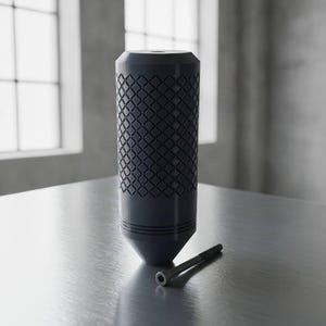 May include: A dark gray cylindrical gear shift knob featuring a textured diamond-patterned grip along its body, a tapered base, and a flat top with a central hole. A single thin metal bolt with a hexagonal head is positioned next to the knob.