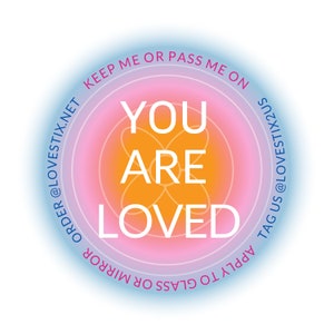 May include: A round sticker with a pink, orange, and blue gradient. The sticker says "You Are Loved" in white text. The text around the sticker says "Keep Me Or Pass Me On Apply To Glass Or Mirror Order @LOVESTIX.NET TAG US @LOVESTIX2US".