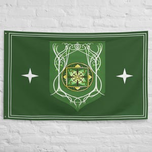 May include: Green wall tapestry with a white border and two white star shapes. The center features a shield design with a gold and green emblem, surrounded by white, stylized vines.