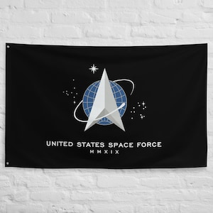 May include: A black flag with the United States Space Force logo. The logo features a white delta symbol with a blue globe inside, surrounded by a white orbit and stars. The text "UNITED STATES SPACE FORCE" and "MMXIX" is printed below the logo.