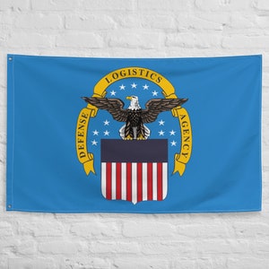 May include: A blue flag with a yellow seal featuring a bald eagle, stars, and the text "Defense Logistics Agency".