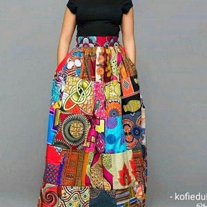 May include: A long, colourful patchwork skirt with a red waistband. The skirt is made of different fabrics with various patterns, including geometric shapes, flowers, and animals.