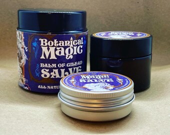 May include: Three different sized containers of "Botanical Magic Balm of Gilead Salve" with a purple and gold label. The largest container is blue, the middle container is black, and the smallest container is silver.
