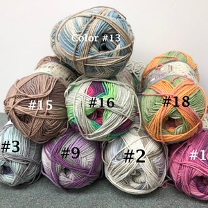 May include: Assortment of 10 balls of yarn in various colors and patterns, including blue, green, pink, purple, and brown. The yarn balls are labeled with numbers 2, 3, 9, 13, 15, 16, 17, and 18.