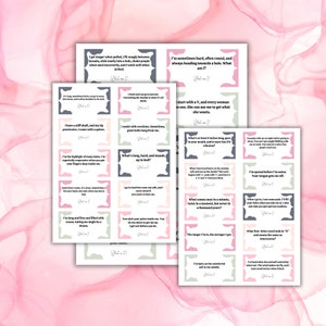 May include: A stack of printed cards with various suggestive riddles and answers. The cards have a pastel color scheme with text in a handwritten style. The background is a soft pink and white watercolor design.