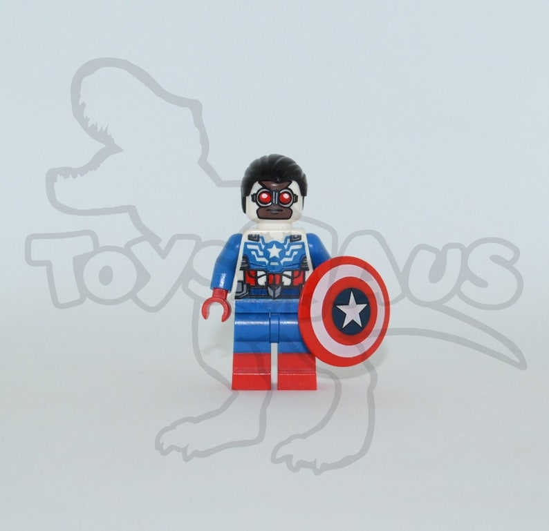 May include: Lego minifigure of a superhero wearing a blue, red and white costume with a red, white and blue shield. The superhero has black hair and a black mask with red eyes.