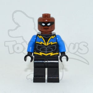 May include: A Lego minifigure of a superhero with a brown head and black eye mask. The figure has blue arms and black legs. The torso is black with yellow lightning bolt designs. The figure has black hands.