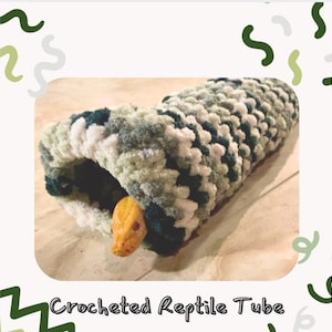 May include: Crocheted reptile tube in green, white and grey with a yellow snake inside. "Crocheted Reptile Tube" is written below the tube.