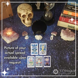 May include: A mystical arrangement featuring tarot cards, crystals, a skull, and a black gazing ball on a starry background. The text reads "Picture of your actual spread available upon request!" and "LVXMagick".