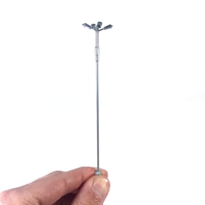 May include: A silver metal street lamp with five lights. The lamp is about 10 inches tall and has a round base.
