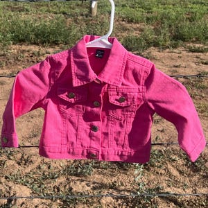 Custom pink jean jacket with fabric back insert