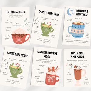 May include: Set of six recipe cards for holiday drinks. Each card features a different drink, including Hot Cocoa Elixir, Candy Cane Syrup, North Pole Night Fizz, Gingerbread Spice Cider, and Peppermint Pixie Potion. The cards have illustrations of mugs and ingredients.