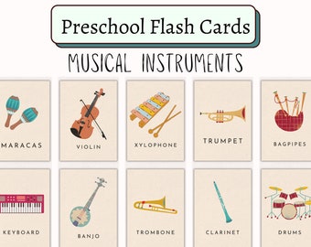 Op de afbeelding: Set flashcards voor kleuters met illustraties van muziekinstrumenten. Kaarten tonen maracas, viool, xylofoon, trompet, doedelzak, keyboard, banjo, trombone, klarinet en drums. De tekst "Preschool Flash Cards" en "MUSICAL INSTRUMENTS" staat bovenaan.