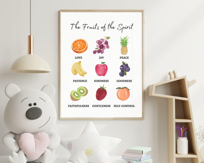 Fruits of the Spirit wall art print for kids room featuring watercolor fruit illustrations representing love, joy, peace, patience, and more. Framed Christian nursery decor with gentle colors and playful design.