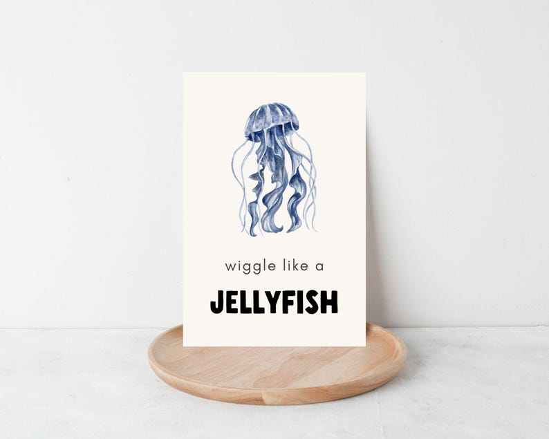 A white card with a blue watercolor jellyfish illustration. The text on the card reads 'wiggle like a JELLYFISH'.