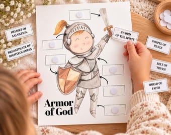 May include: A white educational activity sheet titled Armor of God featuring a watercolor illustration of a knight in silver armor holding a shield. The sheet includes blank rectangular spaces with velcro dots for attaching labels like Helmet of Salvation, Sword of the Spirit, Gospel of Peace, Belt of Truth, Breastplate of Righteousness, and Shield of Faith.